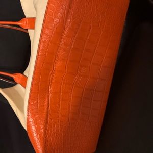 Michael Kors orange and cream colored purse